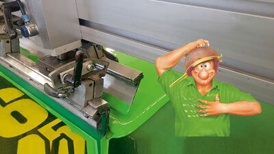 Siebdruckmaschine mit Kaden-Druck-Maskottchen